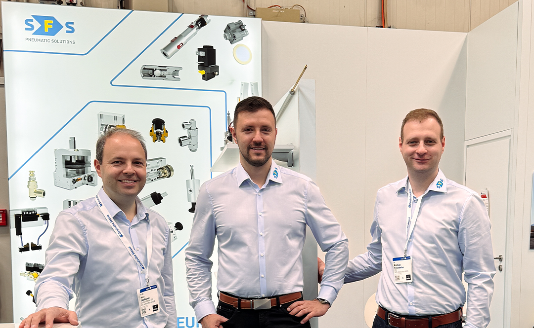 The 3 managing directors of SFS-Fluidsysteme can be seen posing in front of their stand at the Hannover Messe 2025.